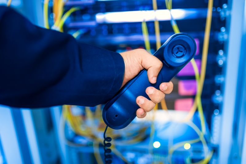 Modern business IP desk phone in server room